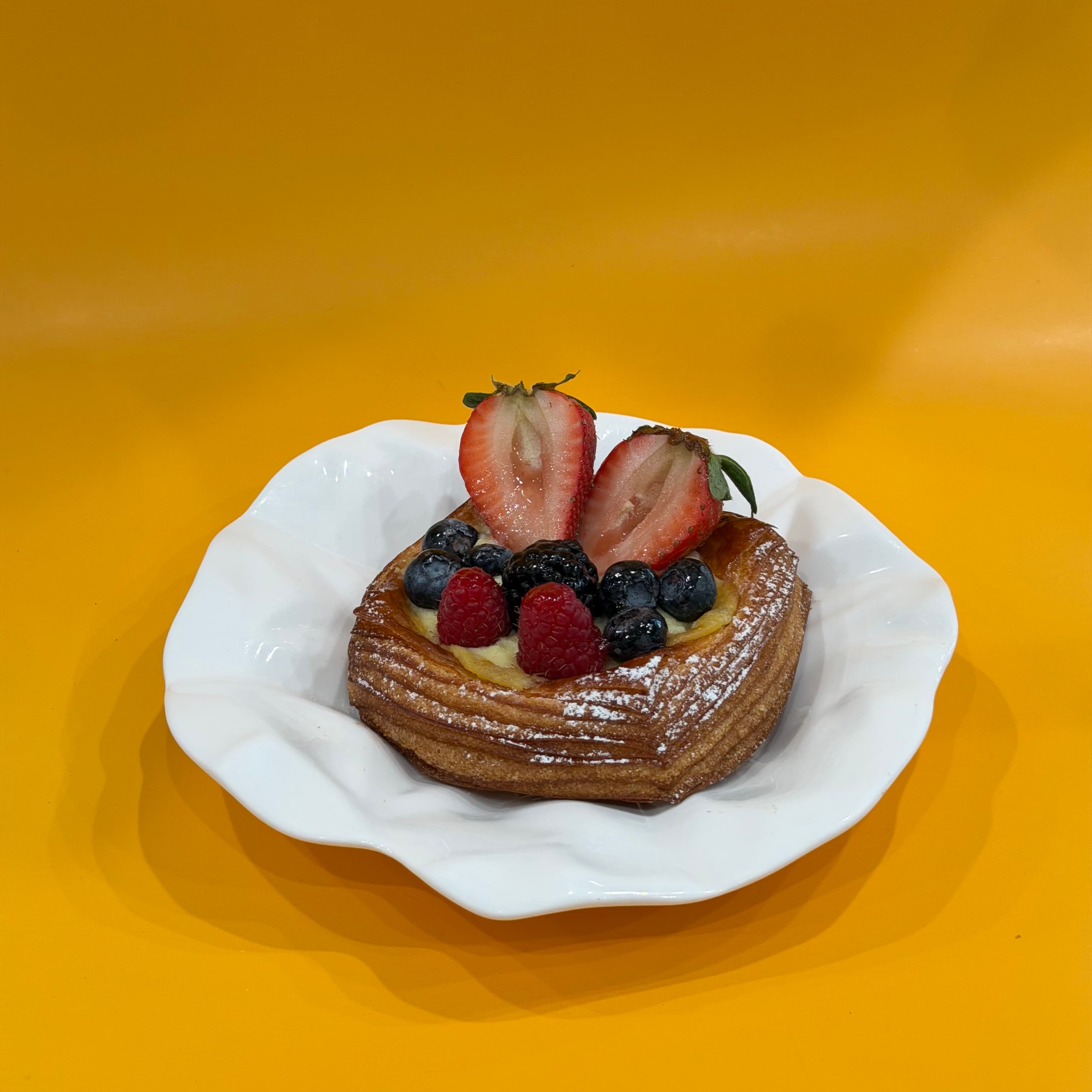 Fruit Danish - Danish with a pastry cream and fresh berries.