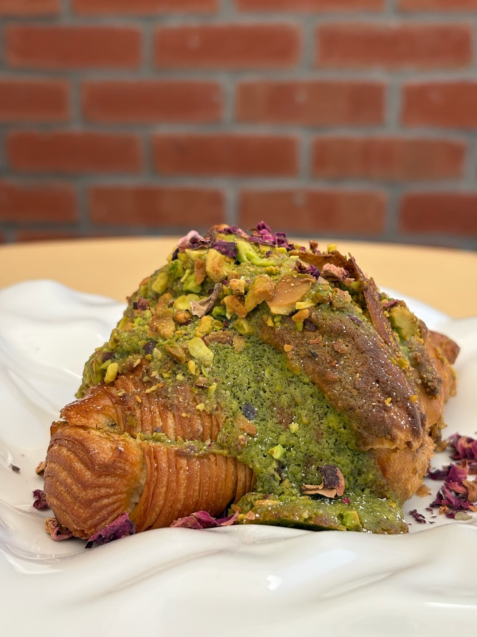 Pistachio Croissant - Classic croissant with a layer of pistachio paste.
