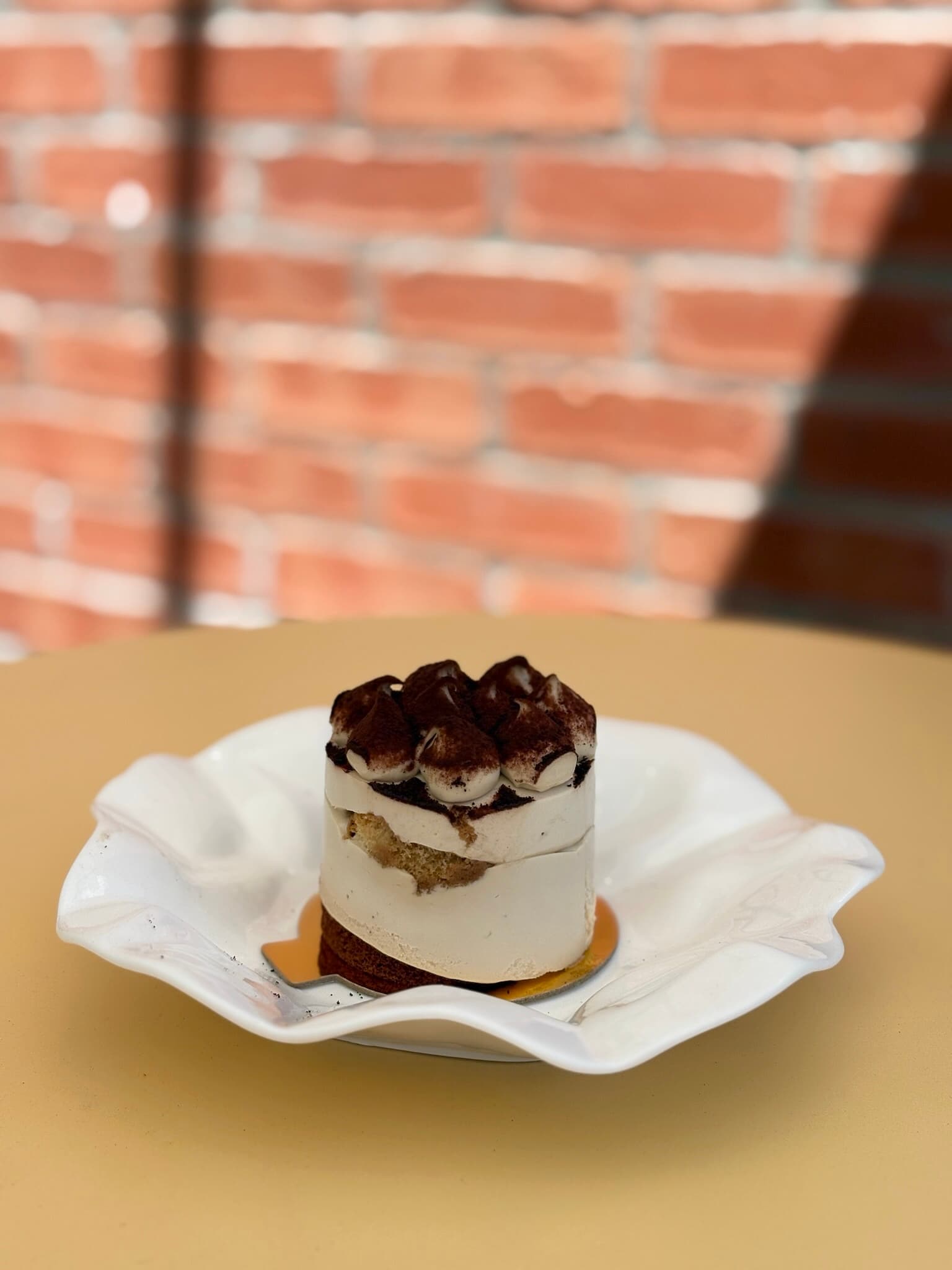 Tiramisu - Layers of espresso-soaked sponge, mascarpone, and cocoa.